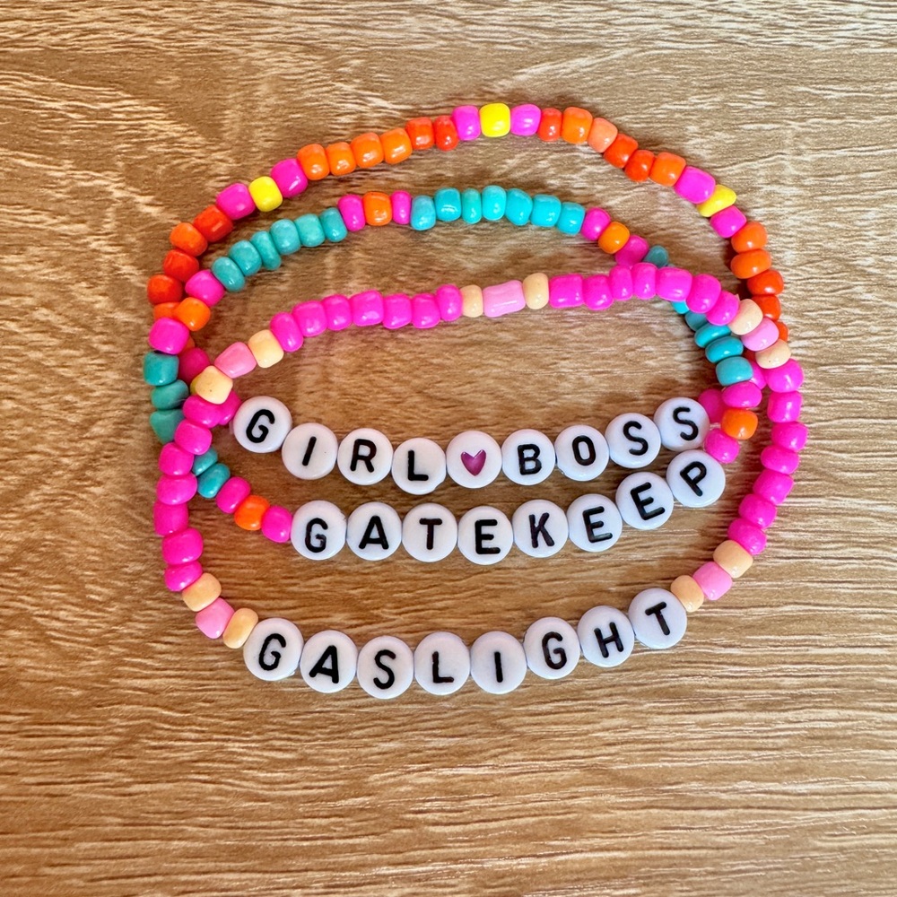 Three beaded elastic bracelets. Girl Boss. Gatekeep. Gaslight.